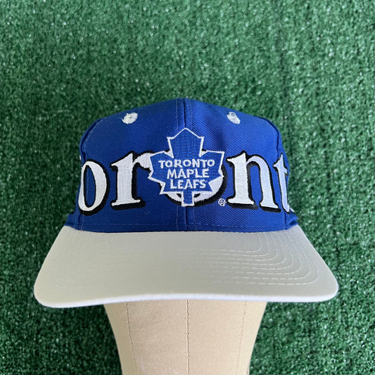 90s Logo 7 NHL Toronto Maple Leafs Spellout Blue Snapback Hat